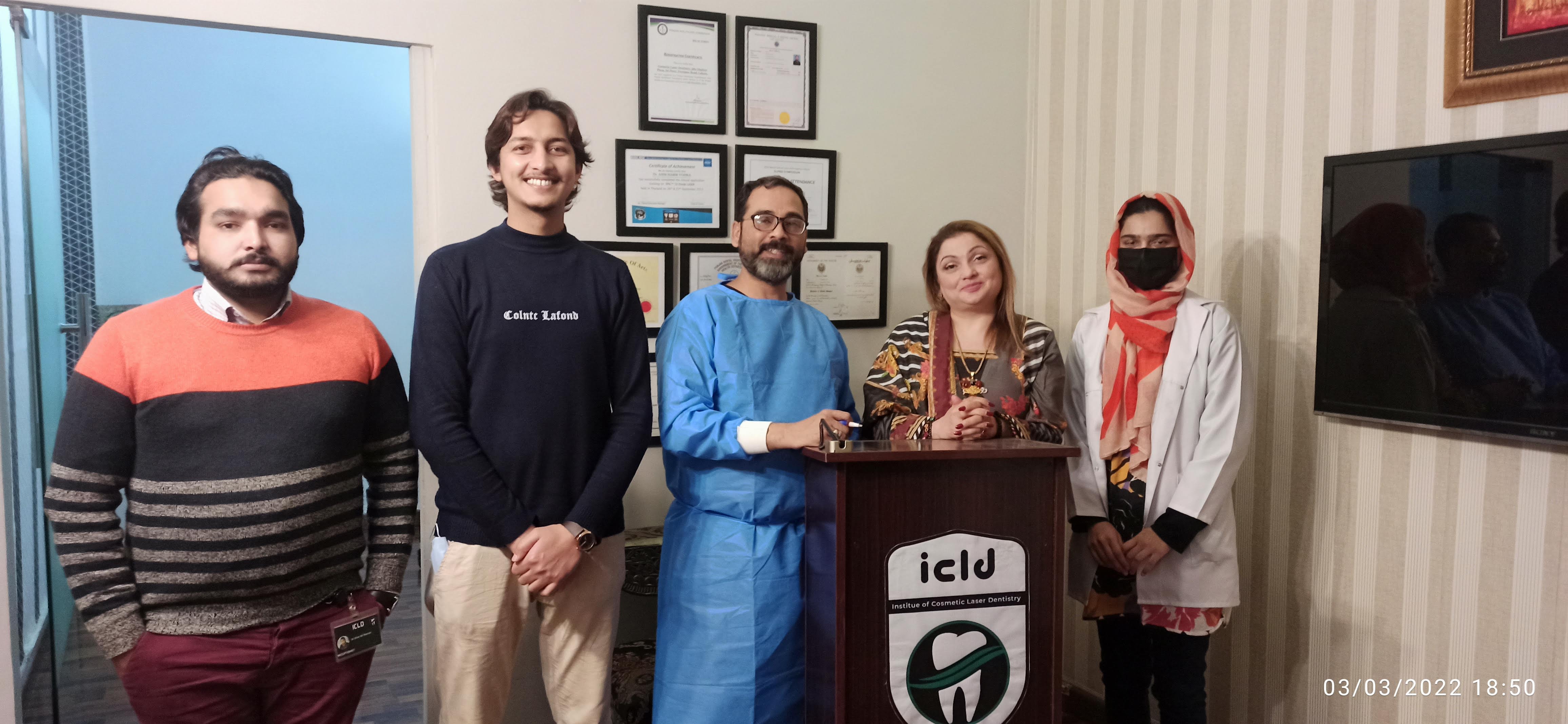 Dr. Asim Habib Vohra with members of the ICLD team at the ICLD podium
